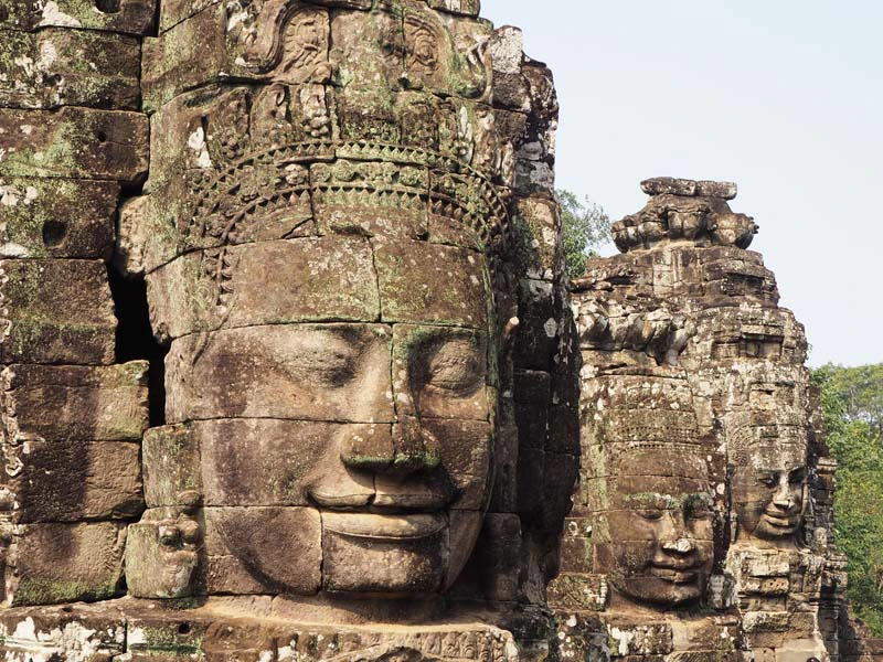 Gesichter aus Stein an dem Tempel in Angkor bei Siem Reap Kambodscha